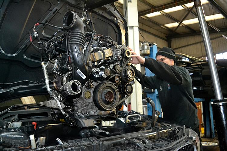 Engine replacement in progress at Salvage Auto Repairs